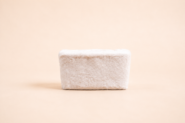 Small rectangular basket, plush white fur, straight view